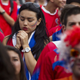 A Costa Rican fan prays during her team's penalty shootout with Greece.